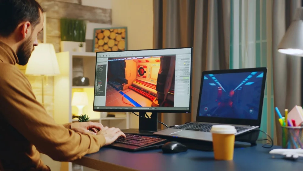 Innovative 3D design workspace with dual monitors and modern tech for digital solutions.