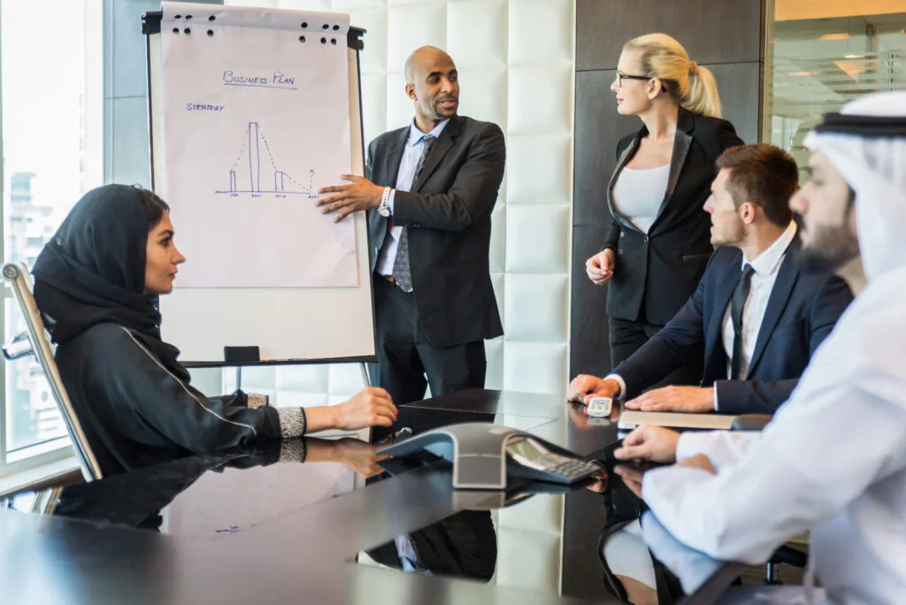 Effective business meeting with diverse professionals discussing growth strategies and business planning.